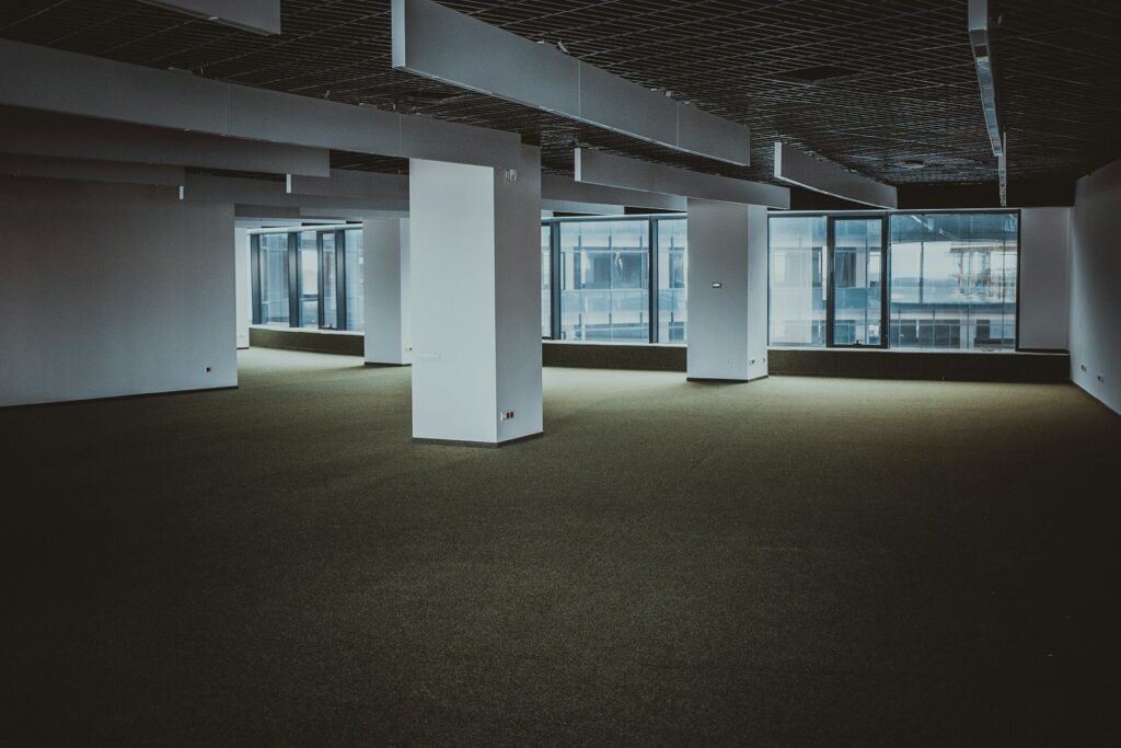 Empty modern office floor with windows